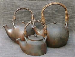 unglazed and fire changed pot with vine handle (Tanba kiln)